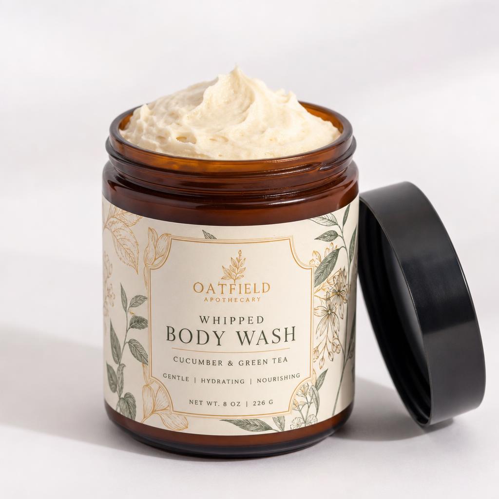 Whipped Botanical Body Wash in an 8 oz amber glass jar with a black lid showing soft whipped cream texture